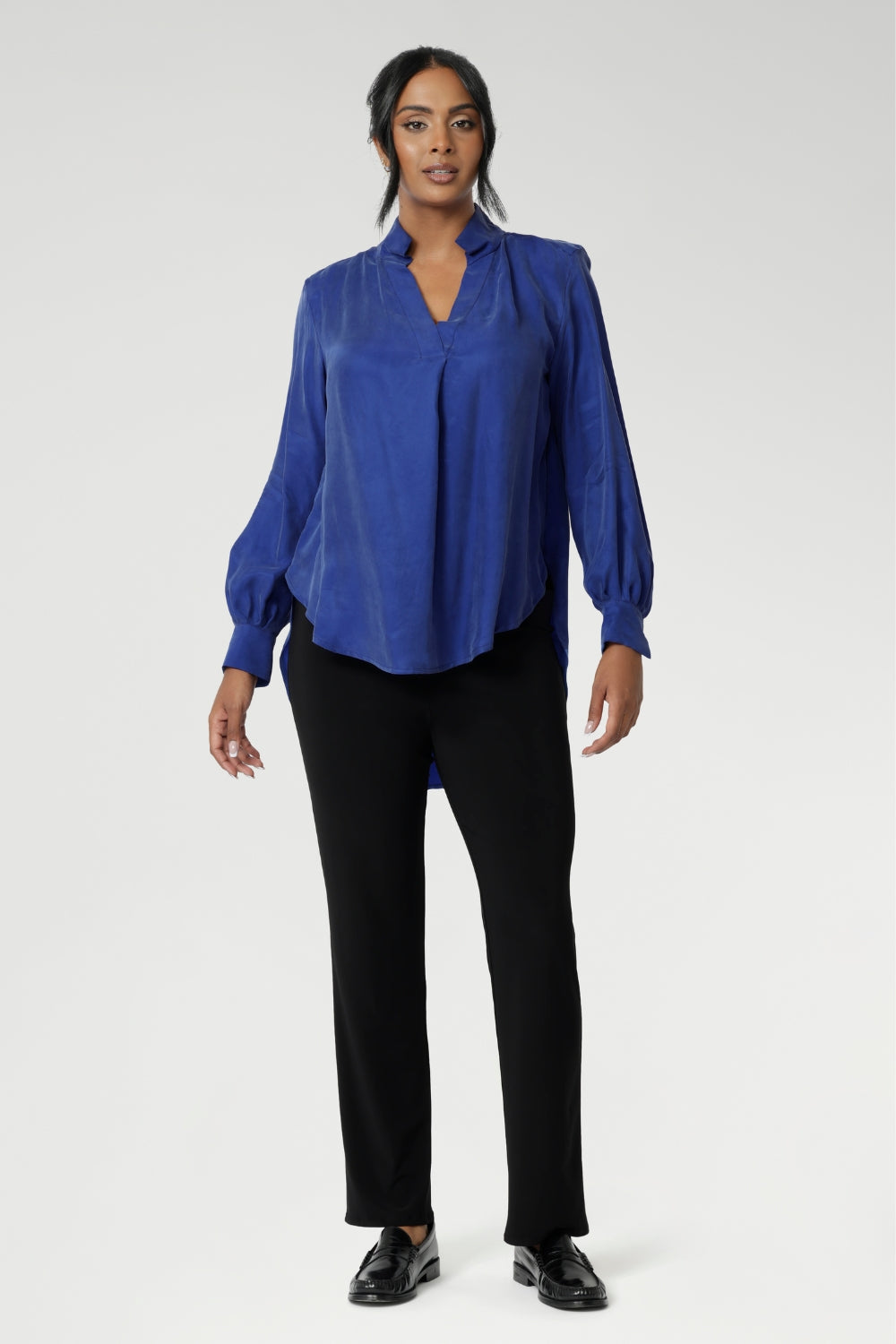Over 30's woman wears black pants styles perfectly for back-to-work attire. These pants can easily be dressed up with a blouse and heels for an elevated look, or dressed down with a casual top and sneakers for effortless comfort. Australian made dry touch jersey fabric provides comfort in the work place and busy days.