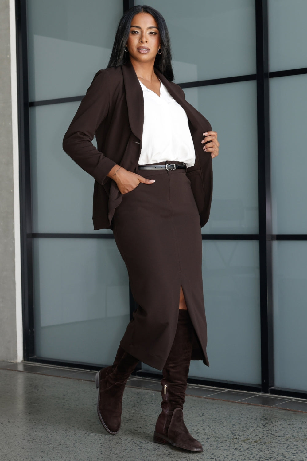 Crafted from a luxe scuba crepe jersey, the fabric offers a softly textured feel with built-in stretch for a flattering, comfortable fit. The vest features a tailored, fitted silhouette with a classic V-neckline and sleeveless cut, ideal for layering over shirts or wearing solo.