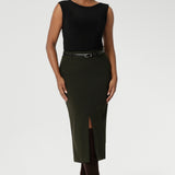 Image of Australian made Olive workwear skirt seen on over 30's woman paired with black boat neck top and brown boots for an elevated workwear look. Sizes 8-24 available at Leina & Fleur.