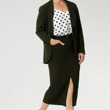 Womans easy care midi skirt made from Scuba crepe jersey fabric. Crafted with functional patch pockets, tailored shawl collar and covered front button. Woman's blazer will have you looking stylish in all corporate and casual occasions. Woman's workwear clothing made in Australia sizes 8-24. Size 10 woman wears her olive coloured midi skirt with matching Olive Blazer and black & white blouse.