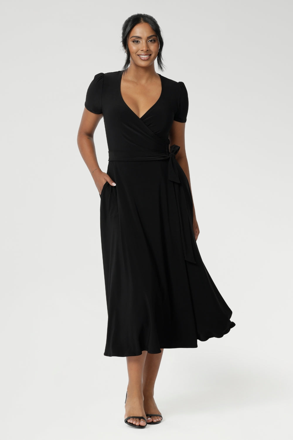 The Alexis dress is often described as the "perfect wrap dress" by many in the L&F community, seamlessly transitioning from work to event and weekend style. Crafted from a black dry-touch jersey fabric with a soft stretch, the Alexis dress offers both comfort and versatility.