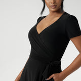 Size 10 woman wears short sleeved dress with side pockets for added practicality, this midi-length dress is an ideal choice for curvy women seeking stylish workwear. Available in sizes 8-24, the Alexis dress is the perfect plus-size wrap dress for women looking for a flattering, functional, and fashionable option.