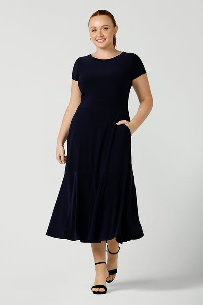 If you're looking for dresses made in Australia, look to this elegant navy dress. This high neck, short sleeve dress with flared skirt and ruffle hemline is a good workwear dress as well as a classic cocktail dress. With a middi-length skirt, shop this dress in plus sizes as well as petite thanks to made-in-Australia women's clothing brand, Lena & Fleur.