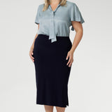 Elevate your wardrobe with the sophisticated Andi Midi Skirt in Navy, designed to keep you both work- and event-ready. Crafted from a navy dry-touch jersey fabric, this skirt offers a soft stretch for all-day comfort. The double-layered tube design includes a stylish side split for added movement and flair, while the soft folded waistband ensures a smooth, comfortable fit. Featuring a convenient pull-on style, the Andi Midi Skirt is cut to a flattering mid-calf length, making it a versatile addition to any
