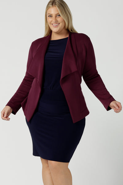 Size 18 woman wears the Lyndon Jacket in Wine a made in Australia jacket in comfortable and easy care modal fabric. Made in Australia for women size 8 - 24. Styled back with a Berit skirt in the Fitzroy print.