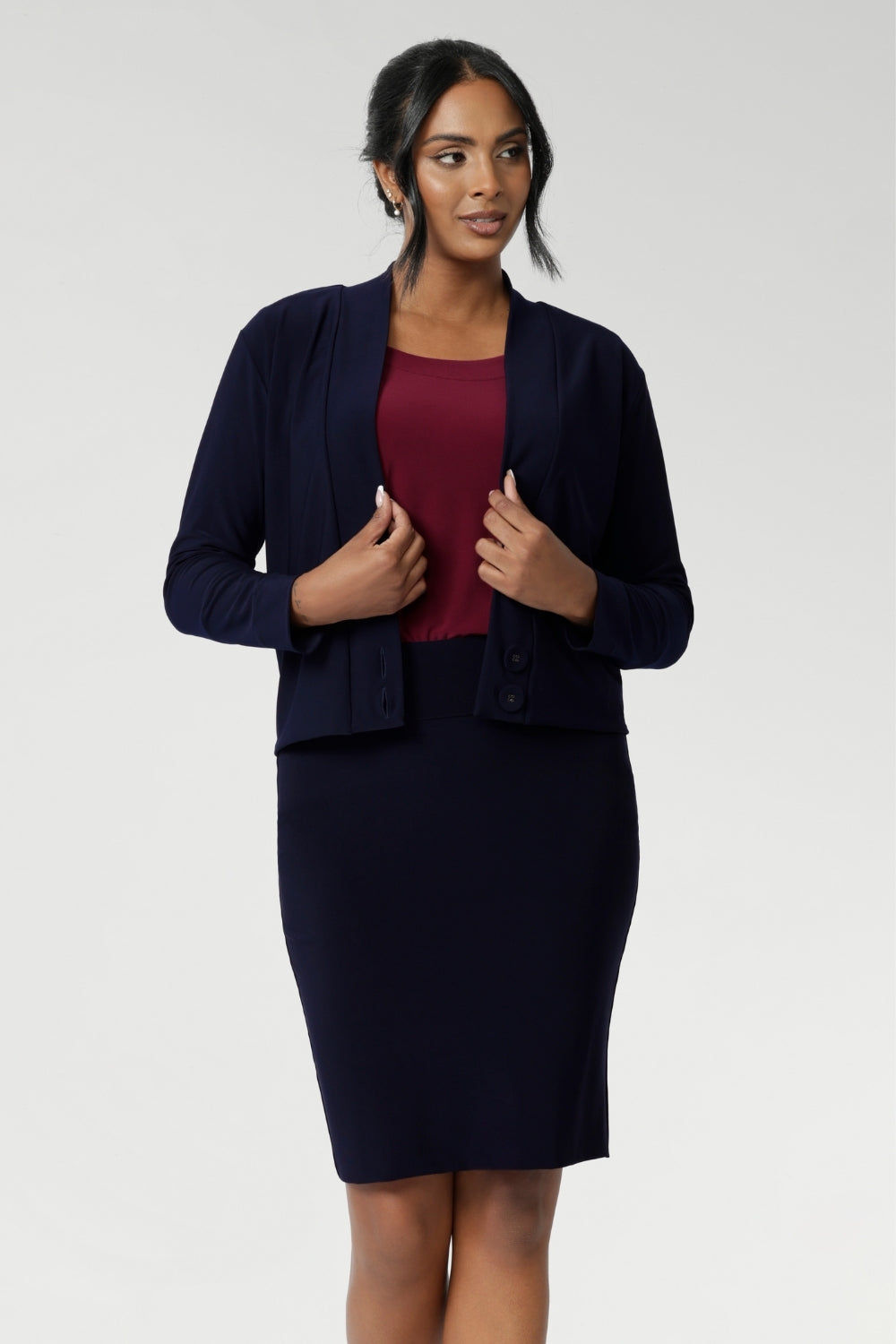 Crafted from a navy dry-touch jersey fabric with a soft stretch, this skirt offers both comfort and style. The double-layer design ensures a flattering fit, while the soft folded waistband adds extra comfort. Featuring a convenient pull-on style, the Andi Tube Skirt is available in a mini length for a bold and stylish look.