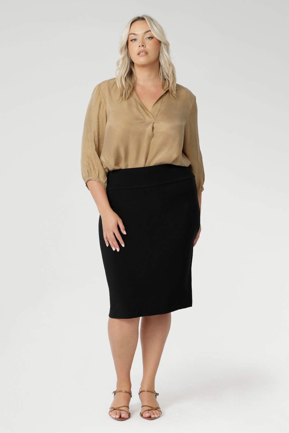 The Andi Tube Skirt in Black is a versatile essential from our luxe mix-and-match separates collection, ideal for the office, travel, or weekend styling.