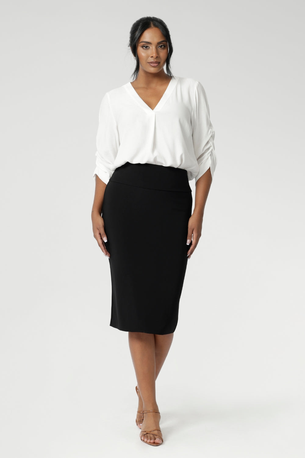 Now available in three lengths, this skirt is crafted from a black dry-touch jersey fabric with a soft stretch for ultimate comfort. Featuring a double-layer tube design, a soft folded waistband, and a convenient pull-on style, the Andi Tube Skirt offers a flattering regular length that pairs effortlessly with any wardrobe.