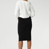 Now available in three lengths, this skirt is crafted from a black dry-touch jersey fabric with a soft stretch for ultimate comfort. Featuring a double-layer tube design, a soft folded waistband, and a convenient pull-on style, the Andi Tube Skirt offers a flattering regular length that pairs effortlessly with any wardrobe.