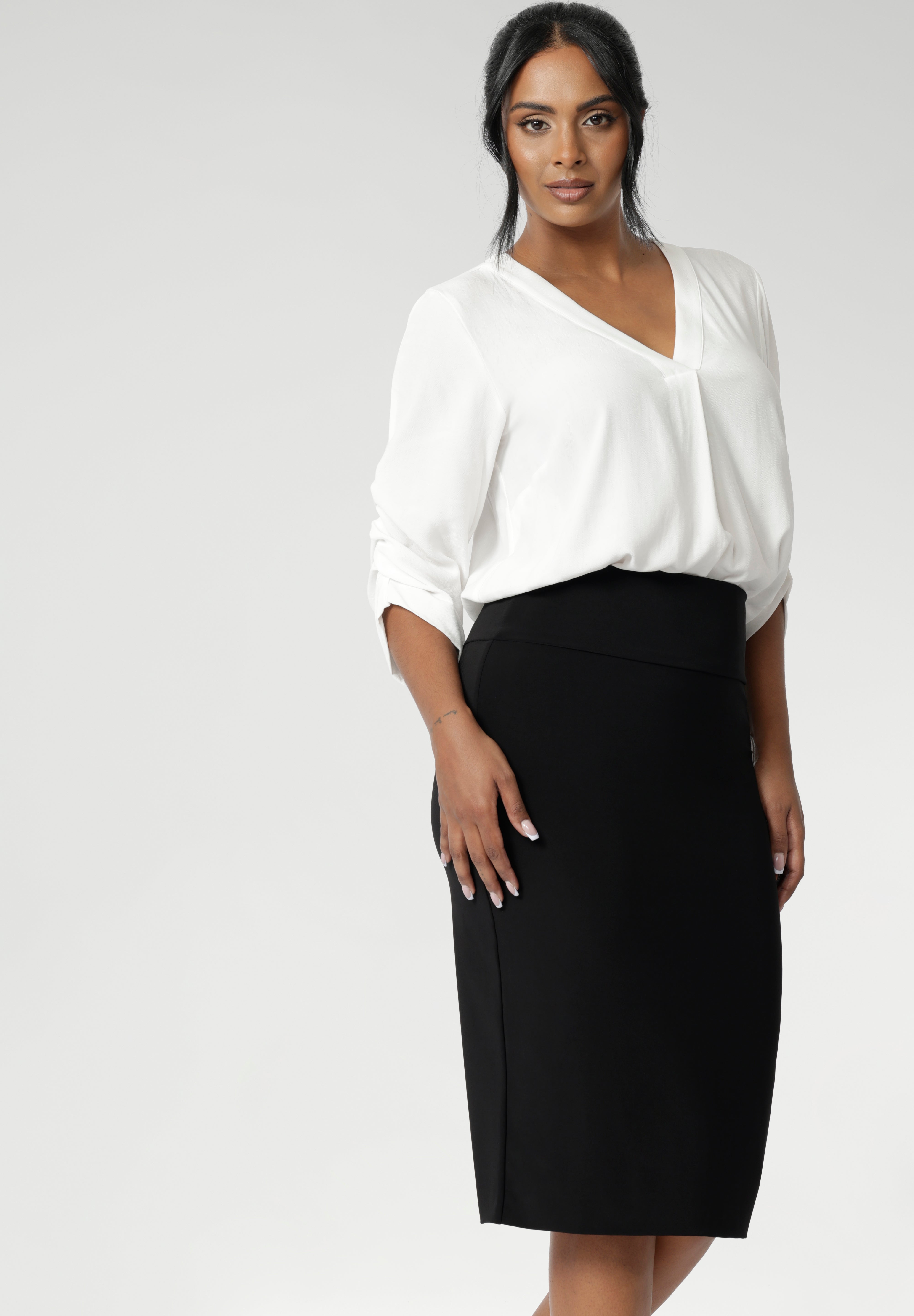 Featuring a double-layer tube design, a soft folded waistband, and a convenient pull-on style. Andi Tube Skirt offers a flattering regular length that pairs effortlessly for casual and corporate dressing. Available in size 8-24