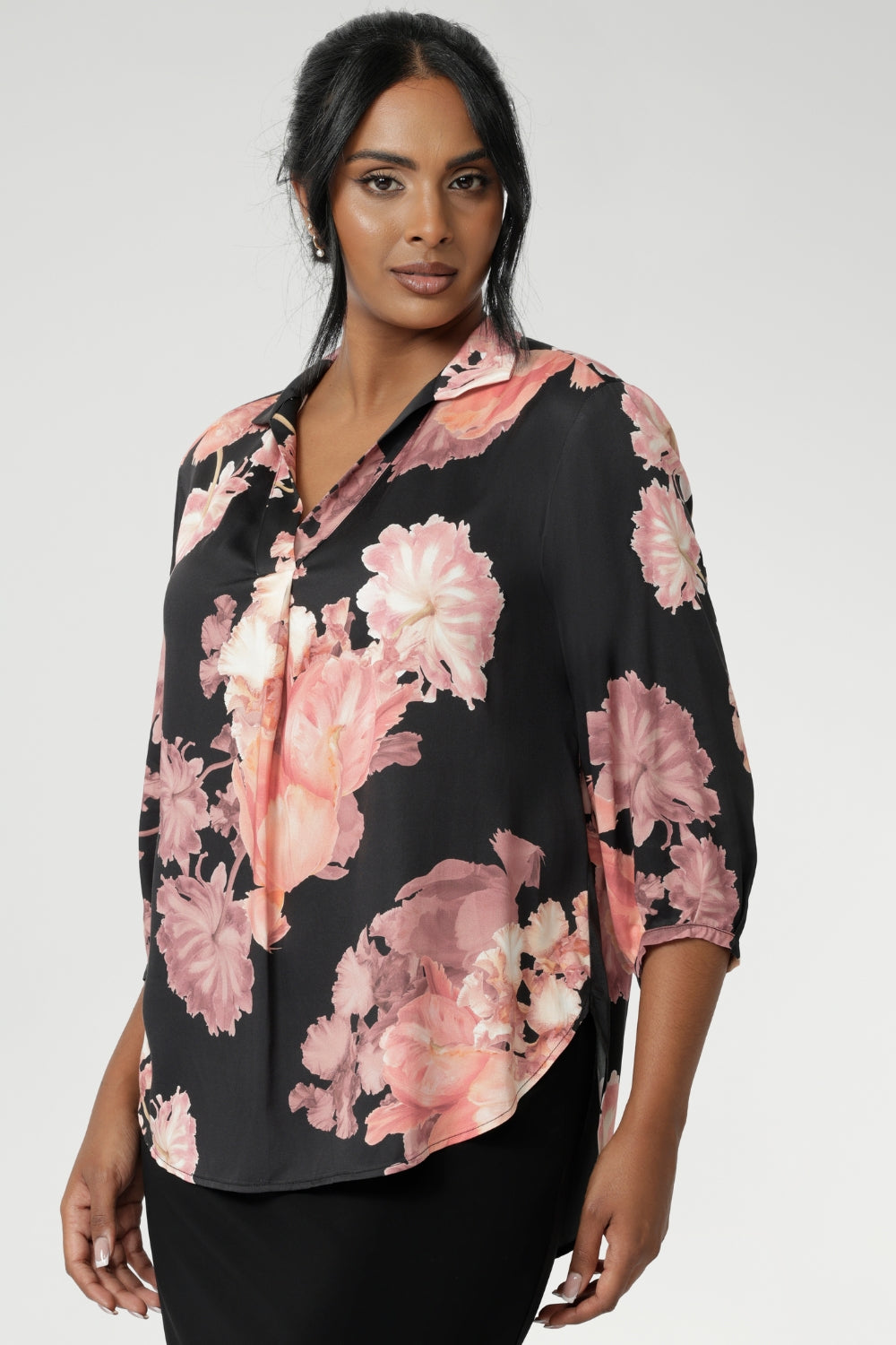This elegant pull-on shirt offers a sophisticated yet comfortable style, perfect for everyday wear. Featuring a semi-fitted cut, it provides a flattering shape without being restrictive. The collar neckline adds a classic touch, while the subtle tuck details below the back neckline bring a refined, tailored look. Its 3/4 length soft sleeves are finished with narrow, bound hems for a neat, polished finish. Available in sizes 8-24.
