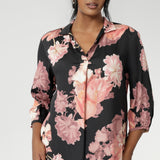 This elegant pull-on shirt offers a sophisticated yet comfortable style, perfect for everyday wear. Featuring a semi-fitted cut, it provides a flattering shape without being restrictive. The collar neckline adds a classic touch, while the subtle tuck details below the back neckline bring a refined, tailored look. Its 3/4 length soft sleeves are finished with narrow, bound hems for a neat, polished finish. Available in sizes 8-24.