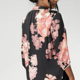 This elegant pull-on shirt offers a sophisticated yet comfortable style, perfect for everyday wear. Featuring a semi-fitted cut, it provides a flattering shape without being restrictive. The collar neckline adds a classic touch, while the subtle tuck details below the back neckline bring a refined, tailored look. Its 3/4 length soft sleeves are finished with narrow, bound hems for a neat, polished finish. Available in sizes 8-24.