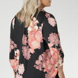 Plus size woman wears pull-on shirt that offers a sophisticated yet comfortable style, perfect for everyday wear. Featuring a semi-fitted cut, it provides a flattering shape without being restrictive. The collar neckline adds a classic touch, while the subtle tuck details below the back neckline bring a refined, tailored look. Its 3/4 length soft sleeves are finished with narrow, bound hems for a neat, polished finish. Available in sizes 8-24.
