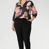 Plus size woman wears pull-on shirt that offers a sophisticated yet comfortable style, perfect for everyday wear. Featuring a semi-fitted cut, it provides a flattering shape without being restrictive. The collar neckline adds a classic touch, while the subtle tuck details below the back neckline bring a refined, tailored look. Its 3/4 length soft sleeves are finished with narrow, bound hems for a neat, polished finish. Available in sizes 8-24.