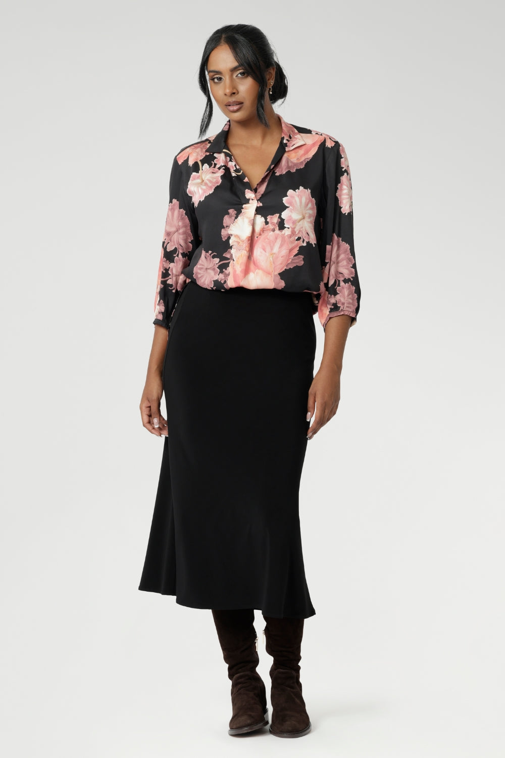 Featuring a semi-fitted cut, it provides a flattering shape without being restrictive. The collar neckline adds a classic touch, while the subtle tuck details below the back neckline bring a refined, tailored look. Its 3/4 length soft sleeves are finished with narrow, bound hems for a neat, polished finish. Available in sizes 8-24.