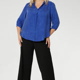 The Arley Shirt in Vivid Blue is a modern wardrobe staple that blends understated elegance with all-day comfort. Crafted from a luxurious suede-touch Tencel fabric, this buttonless, pull-on style offers a clean, contemporary silhouette that’s perfectly suited to office dressing and beyond.