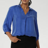 The Arley Shirt in Vivid Blue is a modern wardrobe staple that blends understated elegance with all-day comfort. Crafted from a luxurious suede-touch Tencel fabric, this buttonless, pull-on style offers a clean, contemporary silhouette that’s perfectly suited to office dressing and beyond.
