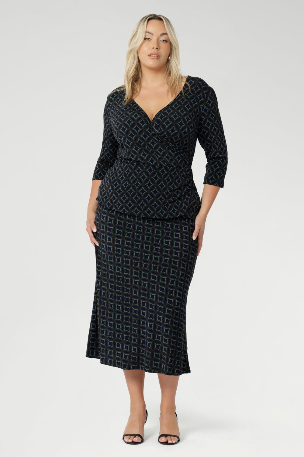 Elevate your workwear wardrobe with this stylish midi skirt, designed to flatter and move with you. Crafted from navy printed dry touch jersey fabric. Women's workwear skirt features a bias-cut design that drapes beautifully, creating an effortless, fluid silhouette that’s both flattering and comfortable.