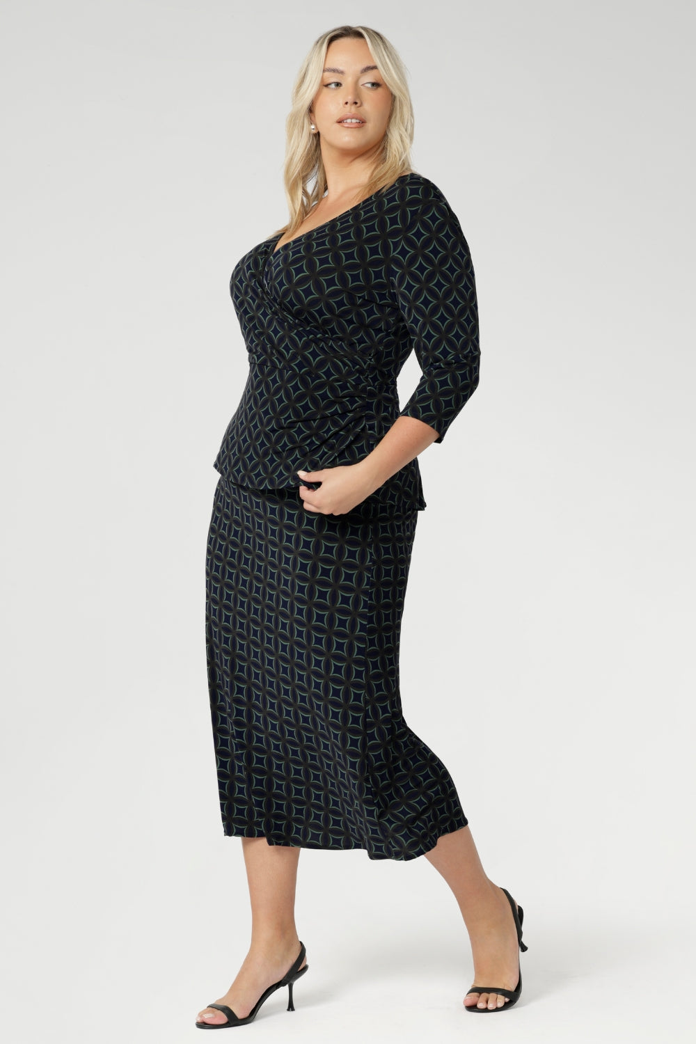 Elevate your workwear wardrobe with this stylish midi skirt, designed to flatter and move with you. Crafted from navy printed dry touch jersey fabric. Women's workwear skirt features a bias-cut design that drapes beautifully, creating an effortless, fluid silhouette that’s both flattering and comfortable.