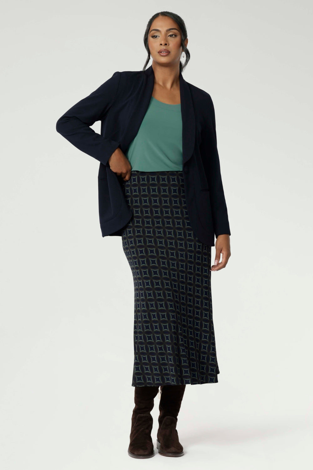Crafted from easy-care, wrinkle-resistant dry-touch jersey, this skirt is designed for all-day comfort and effortless styling. A true all-season piece, it can be worn year-round—pair it with stockings and boots during the winter or layer it under coats and jackets with ease. Available in sizes 8 to 24, this skirt offers both style and practicality, making it an essential staple for any wardrobe.