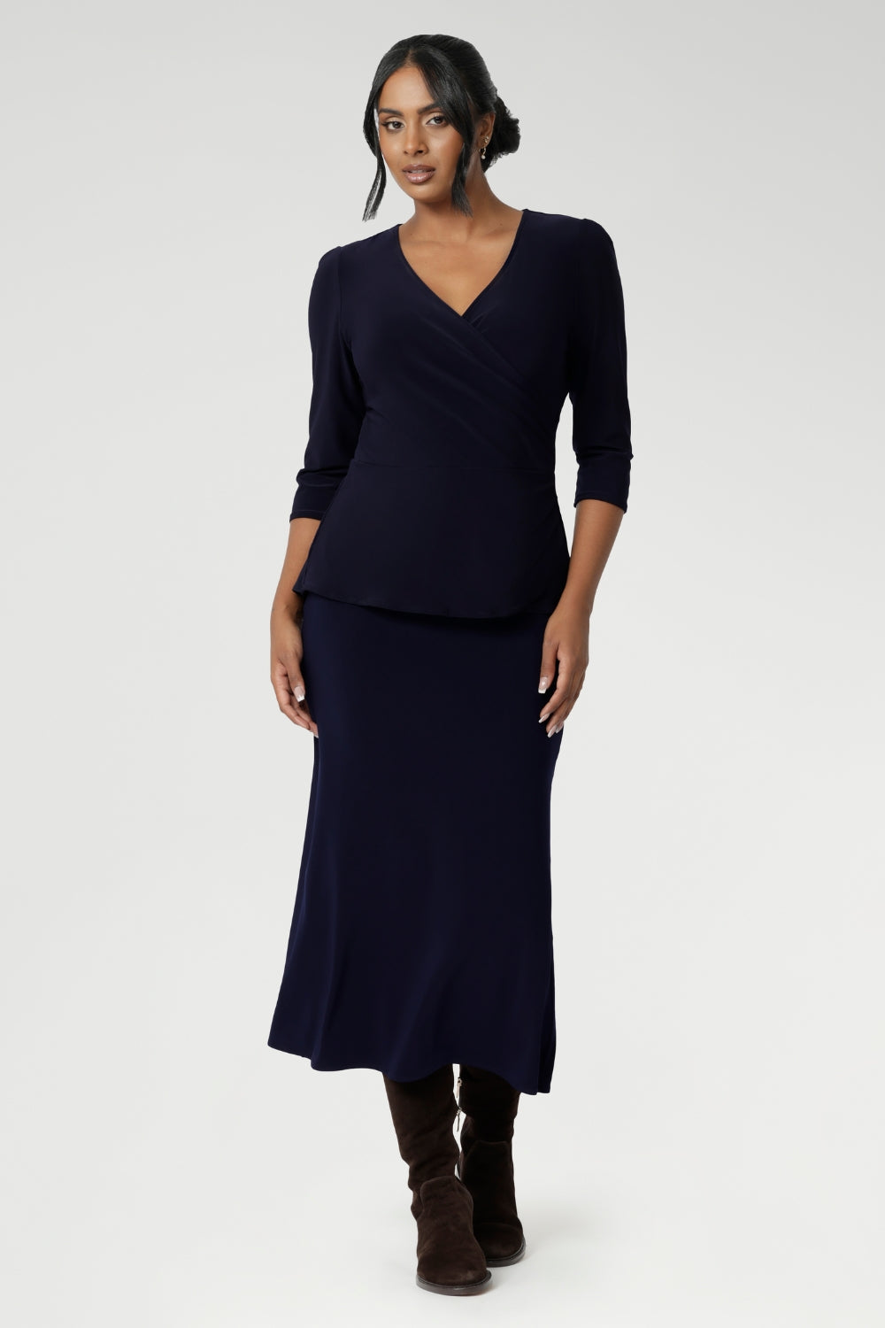 This Australian-made midi skirt is crafted from a soft-touch jersey fabric. Bias cut skirt offers a lightweight feel that is perfect for all-day comfort. Size 10 model wears travel ready skirt in deep navy colour with matching navy fixed wrap top.