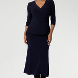 This Australian-made midi skirt is crafted from a soft-touch jersey fabric. Bias cut skirt offers a lightweight feel that is perfect for all-day comfort. Size 10 model wears travel ready skirt in deep navy colour with matching navy fixed wrap top.