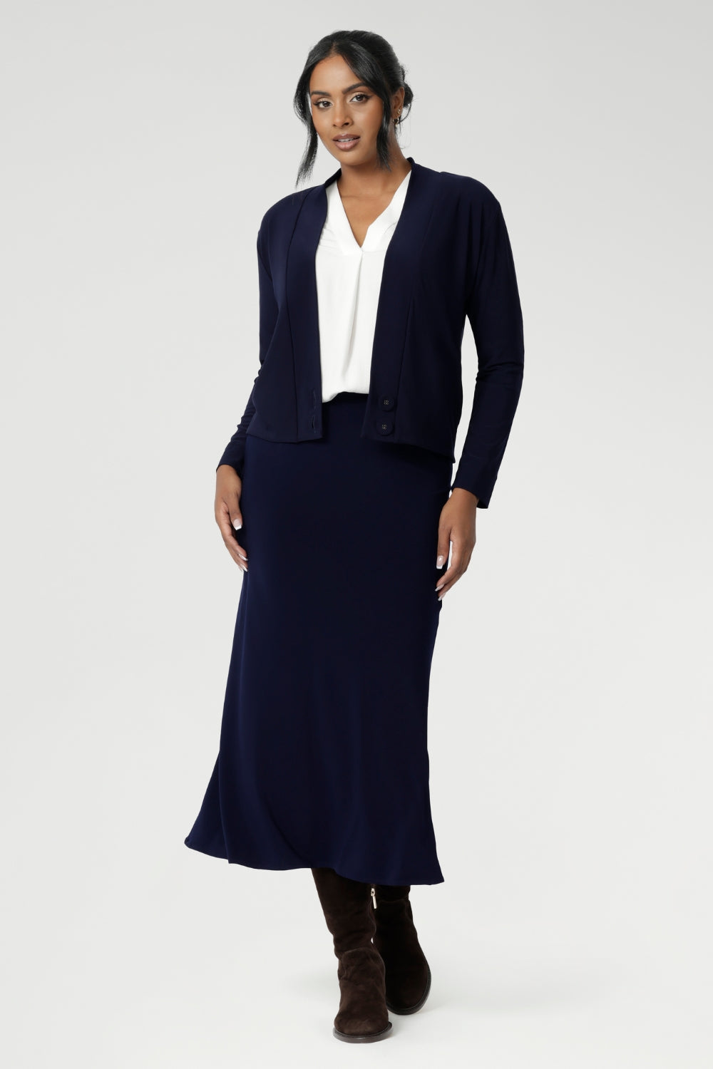 The pull-on style includes internal elastic at the waist for added comfort and ease, while darts at the back provide subtle shaping. With its A-line cut and unlined finish, the Asher Skirt is both versatile and sophisticated, making it a go-to piece for any wardrobe.