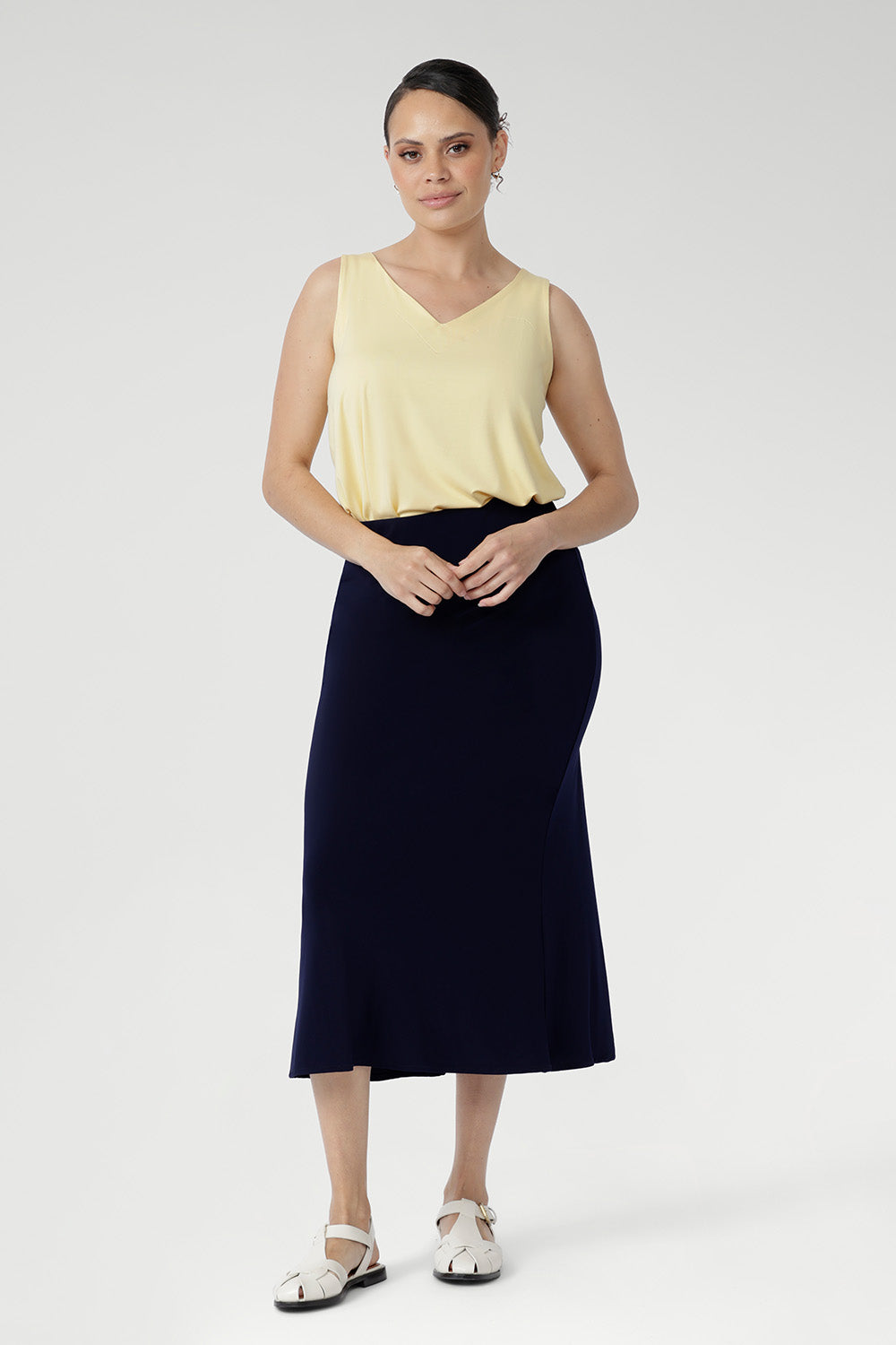 The Asher Skirt is crafted from our signature dry-touch stretch jersey, offering a comfortable, flexible fit that flatters every shape. With an easy pull-on elastic waist and a refined A-line silhouette, it’s the perfect skirt for effortless styling from work to weekend. Proudly designed and made in Australia, this is a wardrobe essential for modern women on the move.
