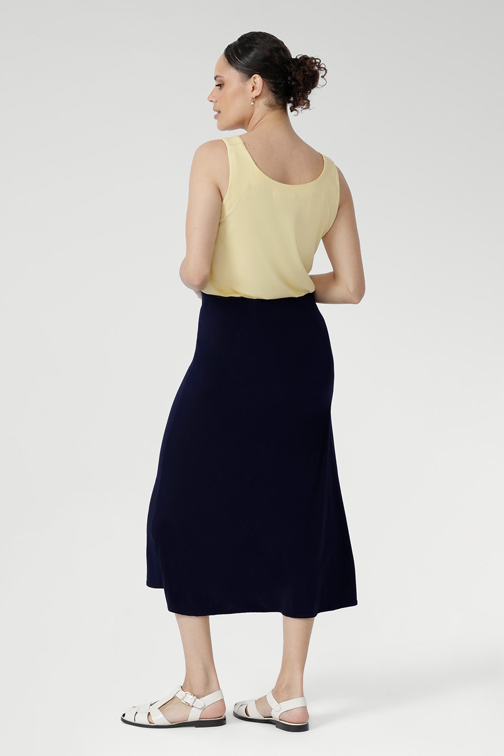 Made from our signature dry-touch stretch jersey, the Asher Skirt delivers a streamlined A-line shape and a smooth, pull-on waistband for ultimate comfort. Designed to move with you, it transitions seamlessly from office days to weekend plans. Australian made and designed, it’s a timeless skirt you’ll reach for season after season.