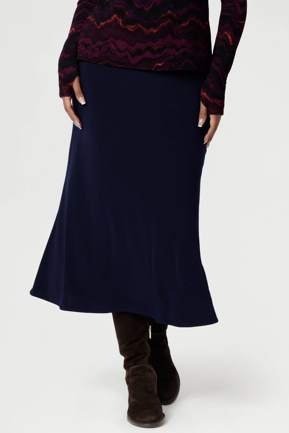 The pull-on style includes internal elastic at the waist for added comfort and ease, while darts at the back provide subtle shaping. With its A-line cut and unlined finish, the Asher Skirt is both versatile and sophisticated, making it a go-to piece for any wardrobe. Available in sizes 8 to 24, it’s the perfect choice for effortless styling that transitions seamlessly from work to weekend.