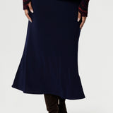 The pull-on style includes internal elastic at the waist for added comfort and ease, while darts at the back provide subtle shaping. With its A-line cut and unlined finish, the Asher Skirt is both versatile and sophisticated, making it a go-to piece for any wardrobe. Available in sizes 8 to 24, it’s the perfect choice for effortless styling that transitions seamlessly from work to weekend.