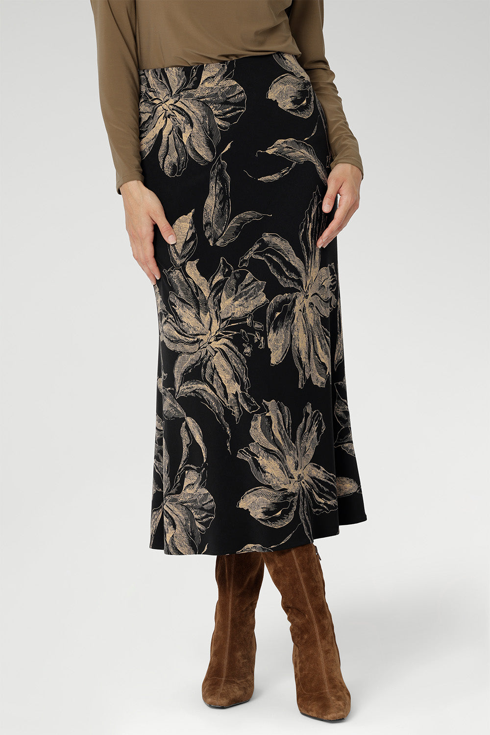 A-line silhouette is cut on the bias for fluid movement and subtle drape, while the internal elastic waistband ensures a seamless, pull-on fit.