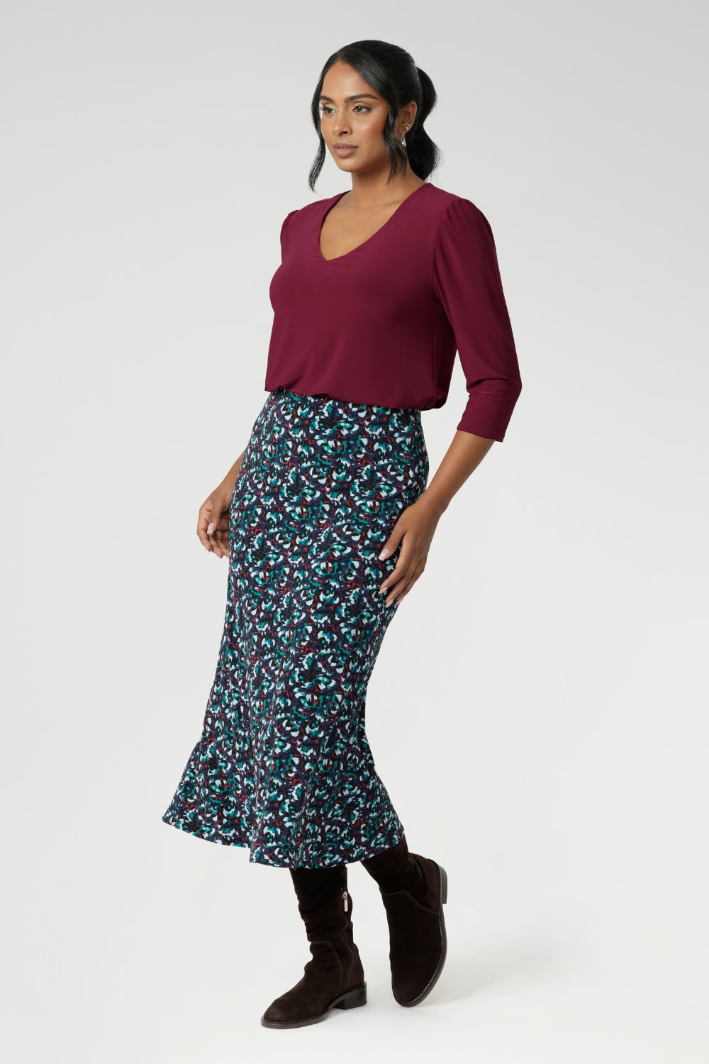 Designed with travel in mind, this midi-length skirt glides easily over the body thanks to its bias cut, offering a fluid drape that flatters without clinging. The pull-on style with a smooth internal elastic waistband keeps things simple and comfortable, while subtle back darts provide soft shaping through the waist and hips. With its clean A-line silhouette and unlined, pocket-free design, Asher maintains a sleek look that layers beautifully across seasons.