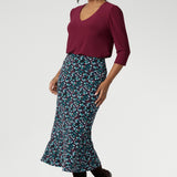 Designed with travel in mind, this midi-length skirt glides easily over the body thanks to its bias cut, offering a fluid drape that flatters without clinging. The pull-on style with a smooth internal elastic waistband keeps things simple and comfortable, while subtle back darts provide soft shaping through the waist and hips. With its clean A-line silhouette and unlined, pocket-free design, Asher maintains a sleek look that layers beautifully across seasons.