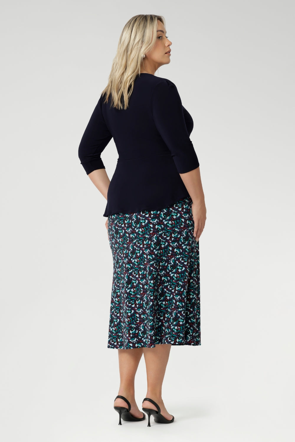 A soft internal elastic waistband ensures a smooth fit, while subtle darts at the back create gentle shaping through the waist and hips. The A-line silhouette gives it just the right amount of flow, with no lining or pockets to interrupt its clean lines.