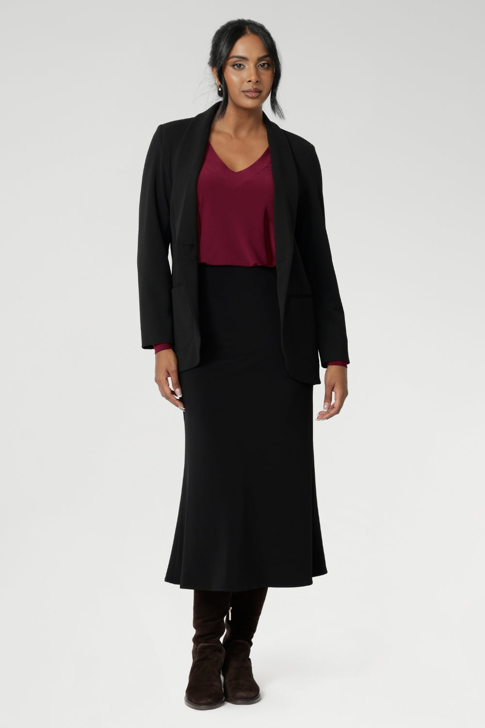 The back shoulder yoke is finished with gentle gathers, offering subtle movement and texture. The curved shirt-tail hemline flatters the hips when worn loose and maintains a chic, modern vibe if you prefer to French tuck. Available in inclusive sizes 8 to 24, the Avery Top in Ruby is a standout piece that blends comfort, quality, and timeless style—all Australian made.