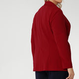 This red work blazer is worn with navy work pants. Curved hemline and front pockets. Made in Australia for women size 8 - 24. Red Blazer adds a vibrant colour to your wardrobe.