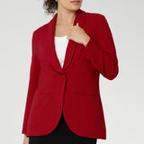 Bright red coloured blazer, a textured scuba crepe This red work blazer is worn with red workwear pants and navy work top. Curved hemline and front pockets. This blazer is Made in Australia for petite women in sizes 8 - 24.