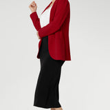 Bright red coloured blazer, a textured scuba crepe. Red work blazer is worn with black skirt and white t-shirt. Curved hemline and front pockets. This blazer is Made in Australia for petite women in sizes 8 - 24.