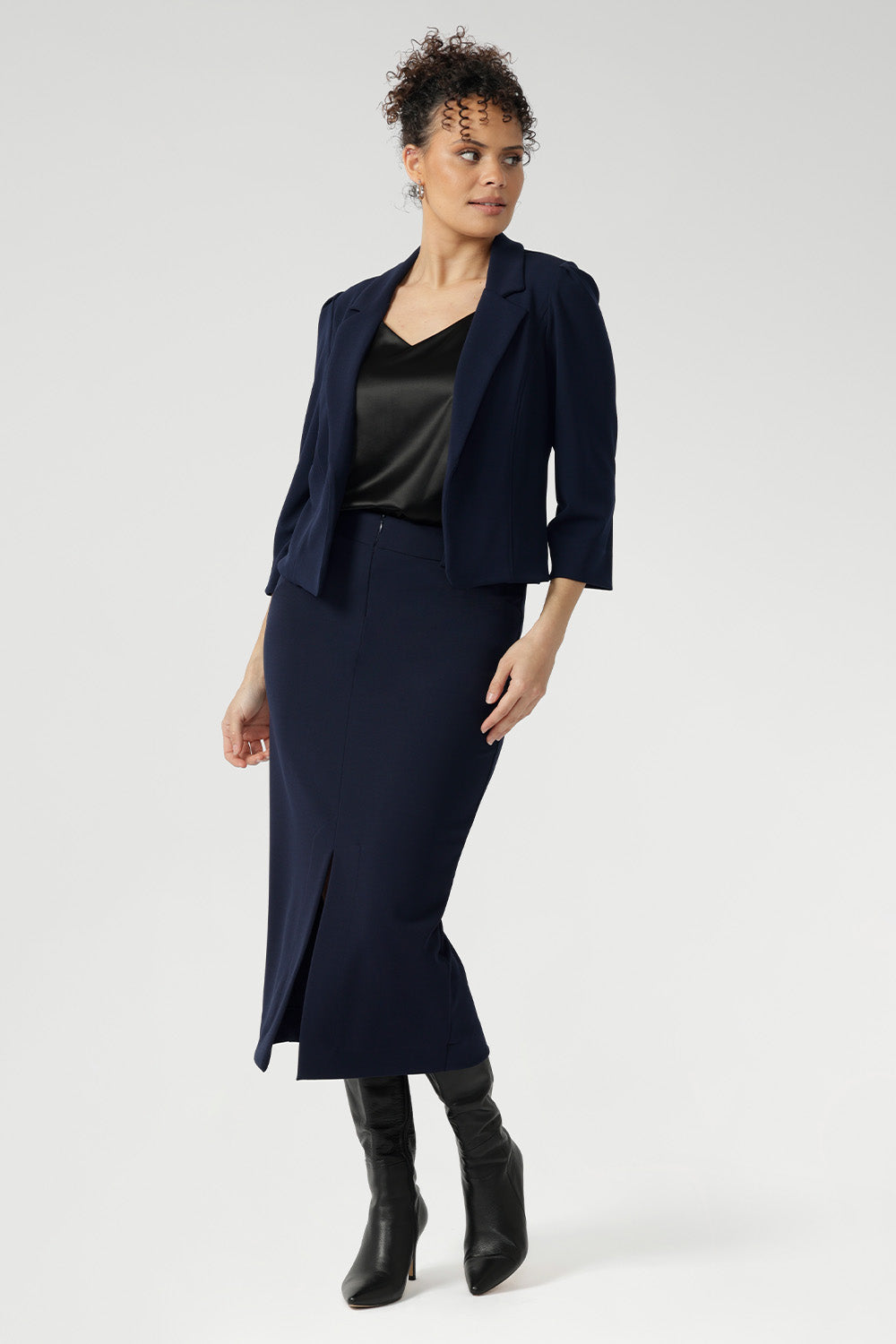The narrow collar and notch lapels add a refined, professional edge, while the double-layer tailored front panels enhance the jacket's sharp silhouette. On the inside, you'll find a phone pocket on the inner left side—subtle yet practical, keeping your essentials secure and out of sight.