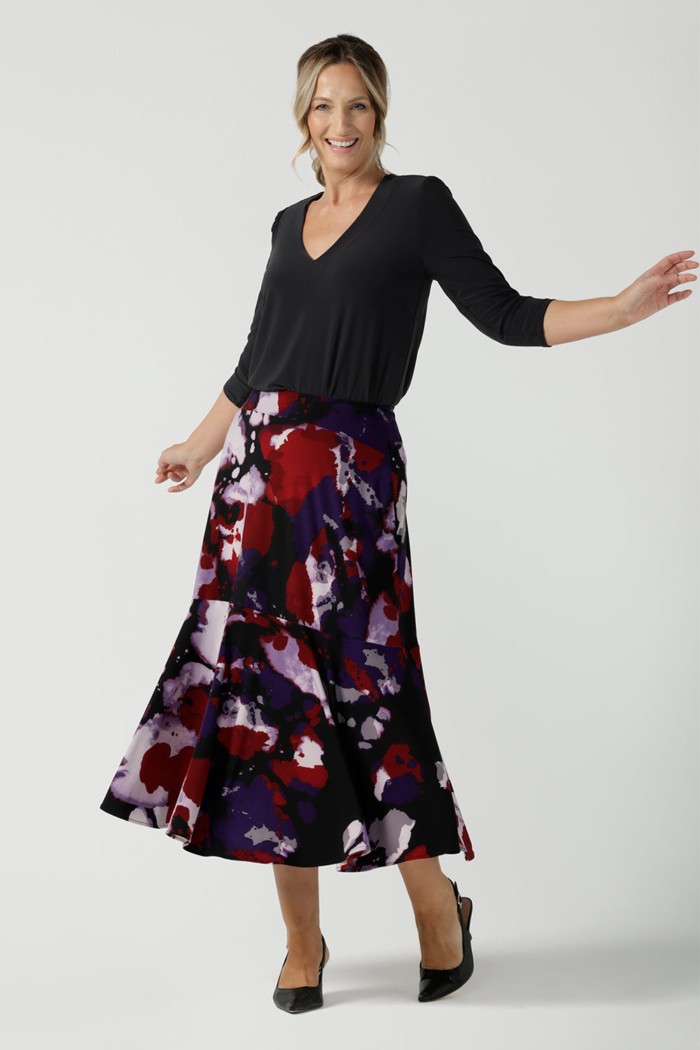Size 10 woman wears the Berit Maxi skirt in the Fitzroy Print. Styled back with black pumps. Made in Australia for women size 8 - 24.