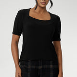 Slim fit top in classic black, this tailored jersey top wears well with workwear separates for an office look and also as a smart casual top. Shop tops online at Australian women's clothing brand, Leina & Fleur in sizes 8-24.