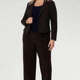 Short fitted sleeved women's Top made from stretchy fabric is perfect for weekend casual and everyday work wear. Available in sizes 8-24. Women's Navy Jersey Top is worn with Brown Pants and Brown Structured Jacket.