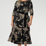 Crafted from our signature black dry-touch stretch jersey, this versatile midi dress is designed to deliver both style and function. Plus size model wears reversible dress with boat neckline and black belt to cinch at the waist.