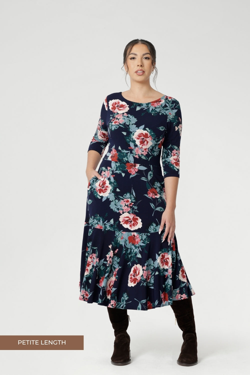 The 3/4 length sleeves offer coverage with a touch of sophistication, while the flowing maxi skirt is finished with a ruffle hemline for added movement and flair. Thoughtfully designed with practical side pockets, a skirt lining, and a double-layer bodice and petite length skirt for the shorter women.