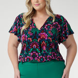 Designed with a relaxed fit, it features a flattering V-neckline and delicate fabric ties that can be worn loose or knotted for a vintage-inspired touch.