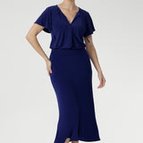 In a rich Sapphire hue, the Bowie Top is where effortless elegance meets everyday ease. Cut from dry-touch jersey with a hint of stretch, it features a fluid fit, refined pleats, and delicate ties. Flutter sleeves and a shirttail hem lend soft movement—ideal for both polished and casual moments.