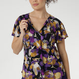 The Bowie Top is a wardrobe essential that blends comfort, style, and versatility in one effortless piece. Crafted from our signature dry-touch stretch jersey, this top features a flattering V-neckline with delicate fabric ties that can be worn open for a relaxed look or tied for a touch of vintage charm.
