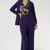 Bowie Top—a beautifully designed wardrobe essential that blends comfort, style, and versatility in one effortless piece. Pair your Bowie Top with matching suit set in purple scuba crepe.